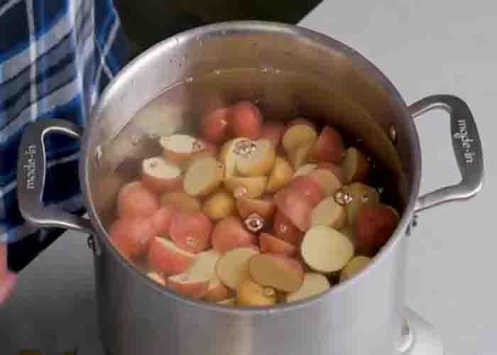 Boiling the potatoes for the salad recipe
