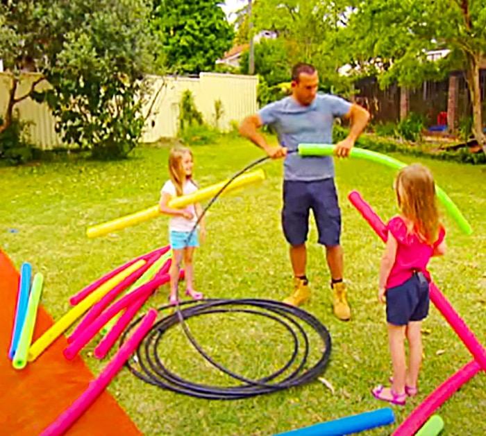 Build A Monster Slip And Slide with Pool Noodles And A Plastic Tarp