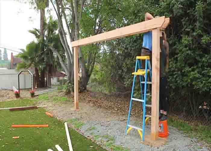 Adding the beams of the DIY hammock pergola