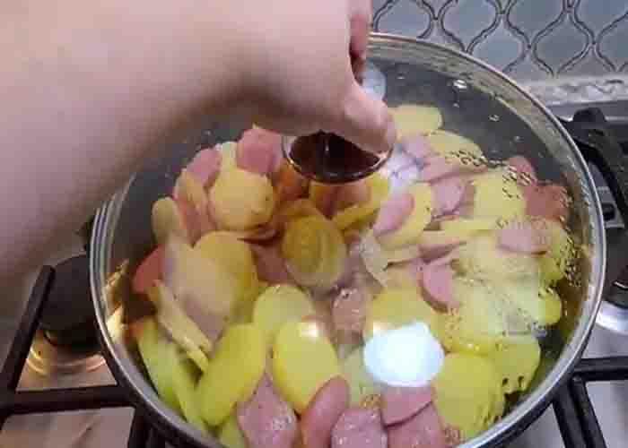 Cooking the sausage and potatoes in the skillet