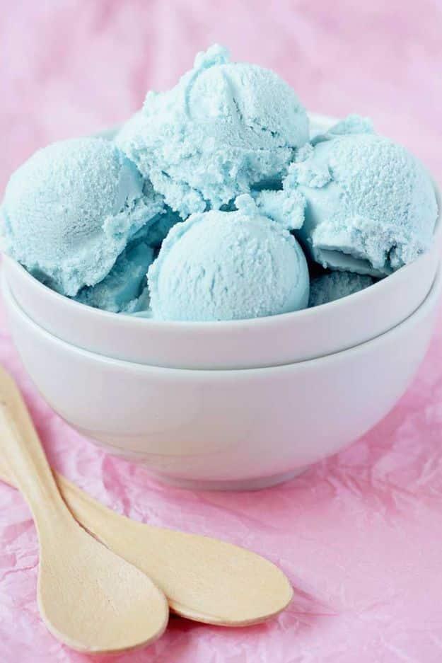 Cotton candy ice cream in pastel blue and pink scoops in a waffle cone, a fun homemade frozen dessert