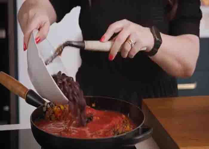 Adding the beans to the Tex-Mex style ground beef