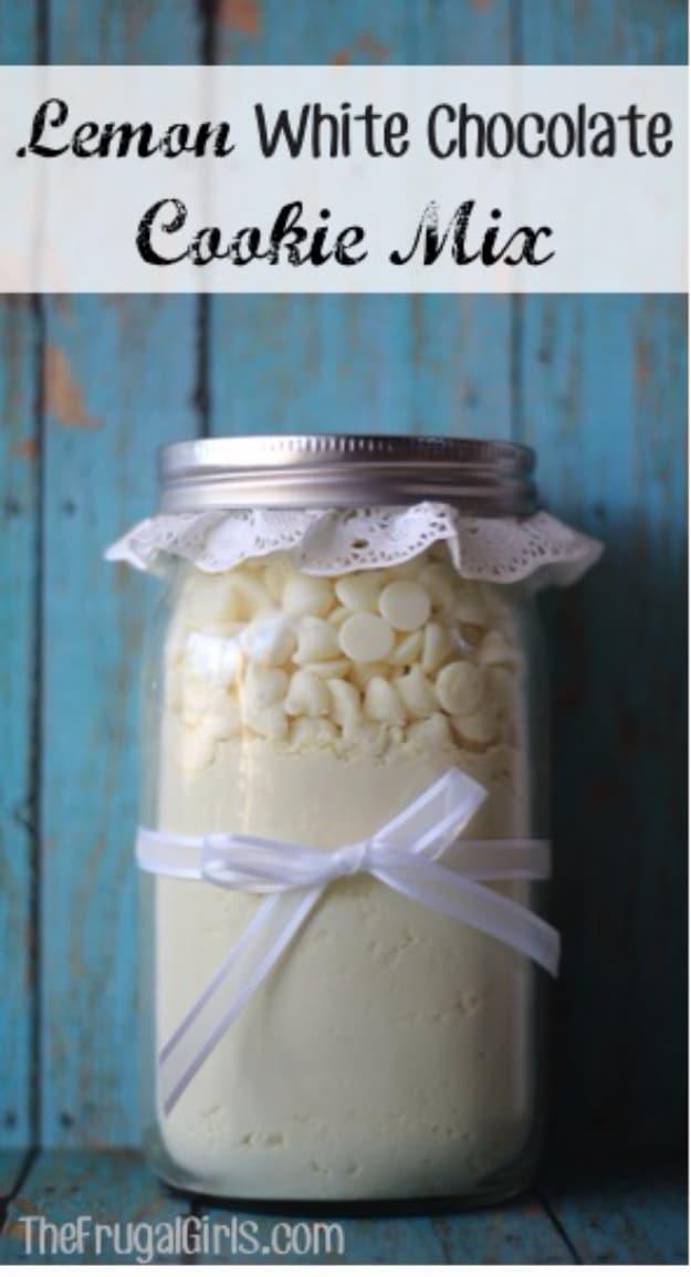 Wide mouth mason jar of lemon cake mix topped with white chocolate chips and tied with a white ribbon bow