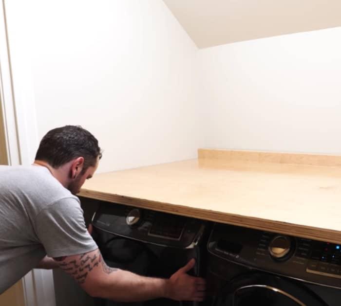 learn how to do a complete laundry room makeover with new shelves