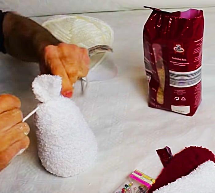 Learn to make this quick easy cheap DIY sock snowman with socks and rice