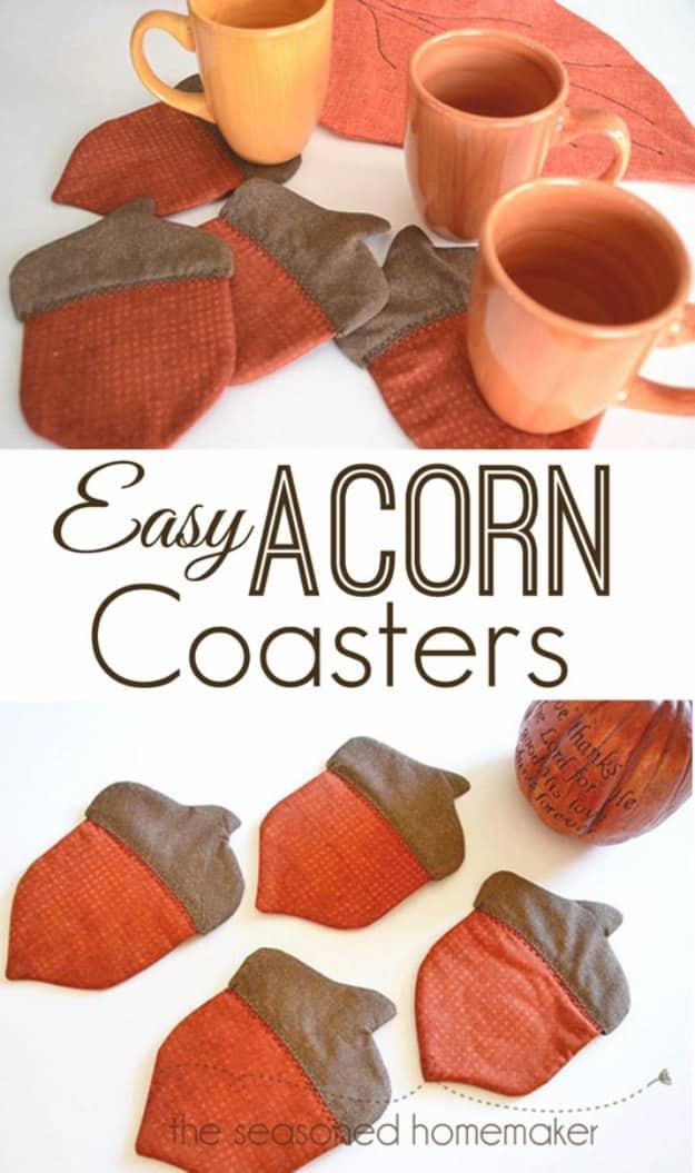 Easy acorn coasters, a fall home sewing project with quilted rust and brown acorn shapes beside orange coffee mugs