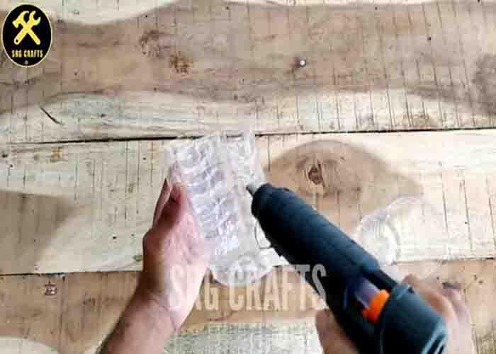 Attaching the plastic bottles together to make the hanging planter