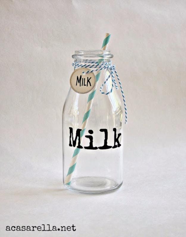 Painted labels with sharpies, a small glass milk bottle lettered in black with a paper straw and blue bakers twine