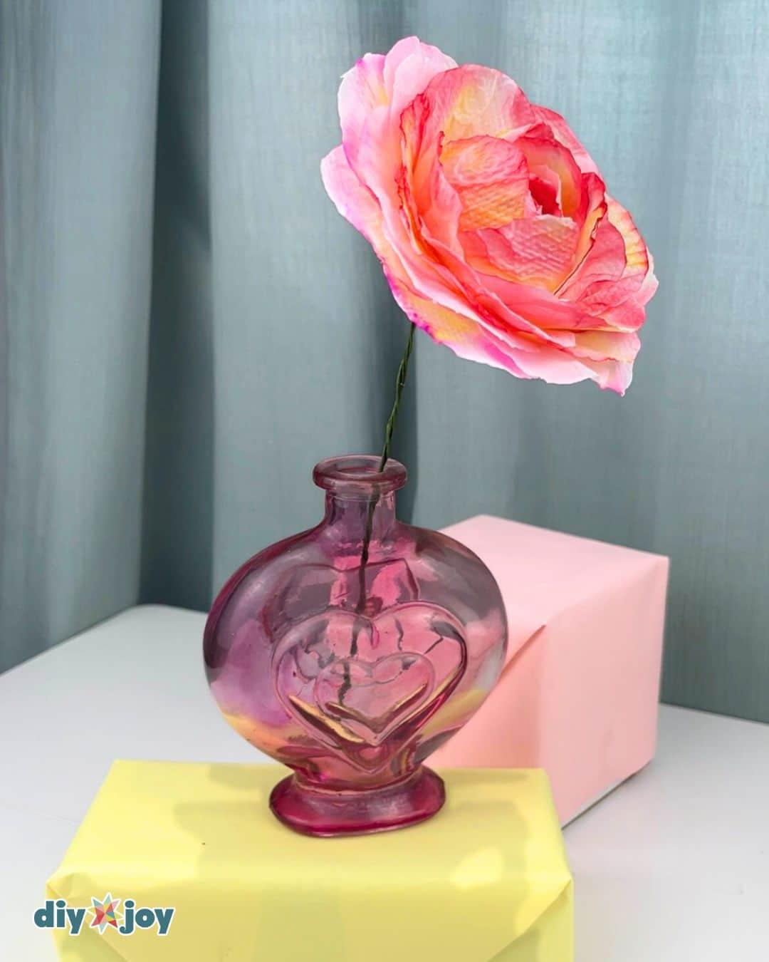 Toilet paper crafts for adults, finished handmade roses with detailed colored petals shown in a group