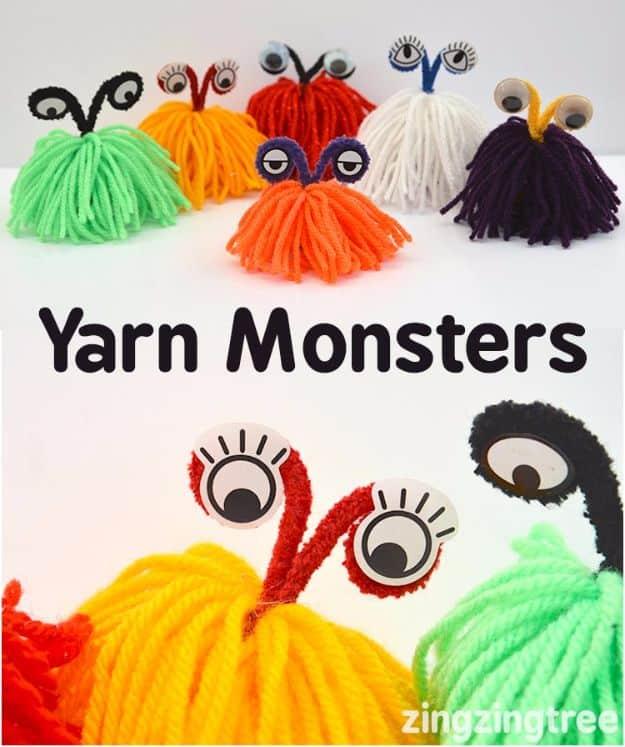 Six yarn monsters in green, orange, white and purple with pipe cleaner stalks and googly eyes on a white background
