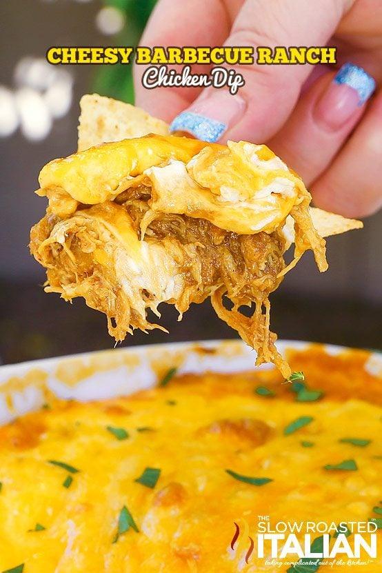 Cheesy BBQ ranch chicken dip baked golden in a square dish with barbecue chicken under melted cheese