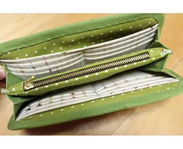 Zipper wallet DIY, an open green polka dot wallet with a gold zipper down the center and printed card slots
