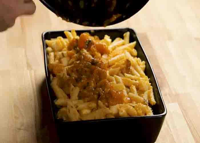 Assembling the baked pasta with butternut squash