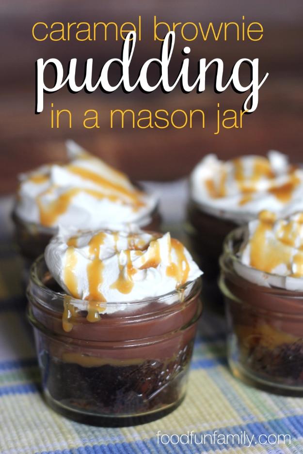 Gooey caramel brownie pudding in a jar with a brownie base, chocolate pudding, whipped cream and caramel