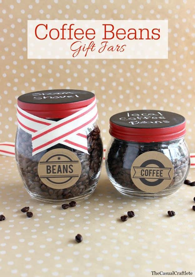 Mason jar filled with whole coffee beans tied with ribbon as a Valentine's Day gift for a coffee lover