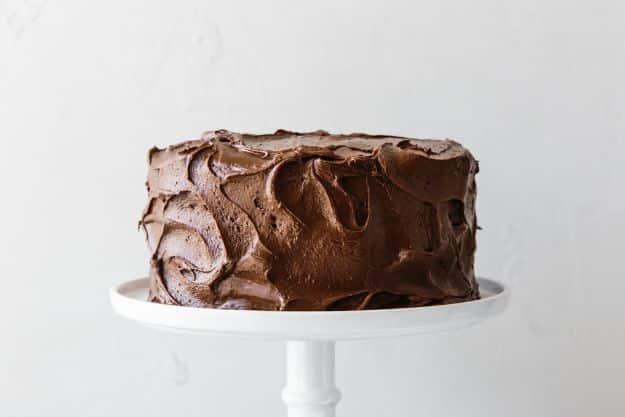 Paleo chocolate layer cake with almond and coconut flour and whipped ganache frosting, grain free recipe for a celebration