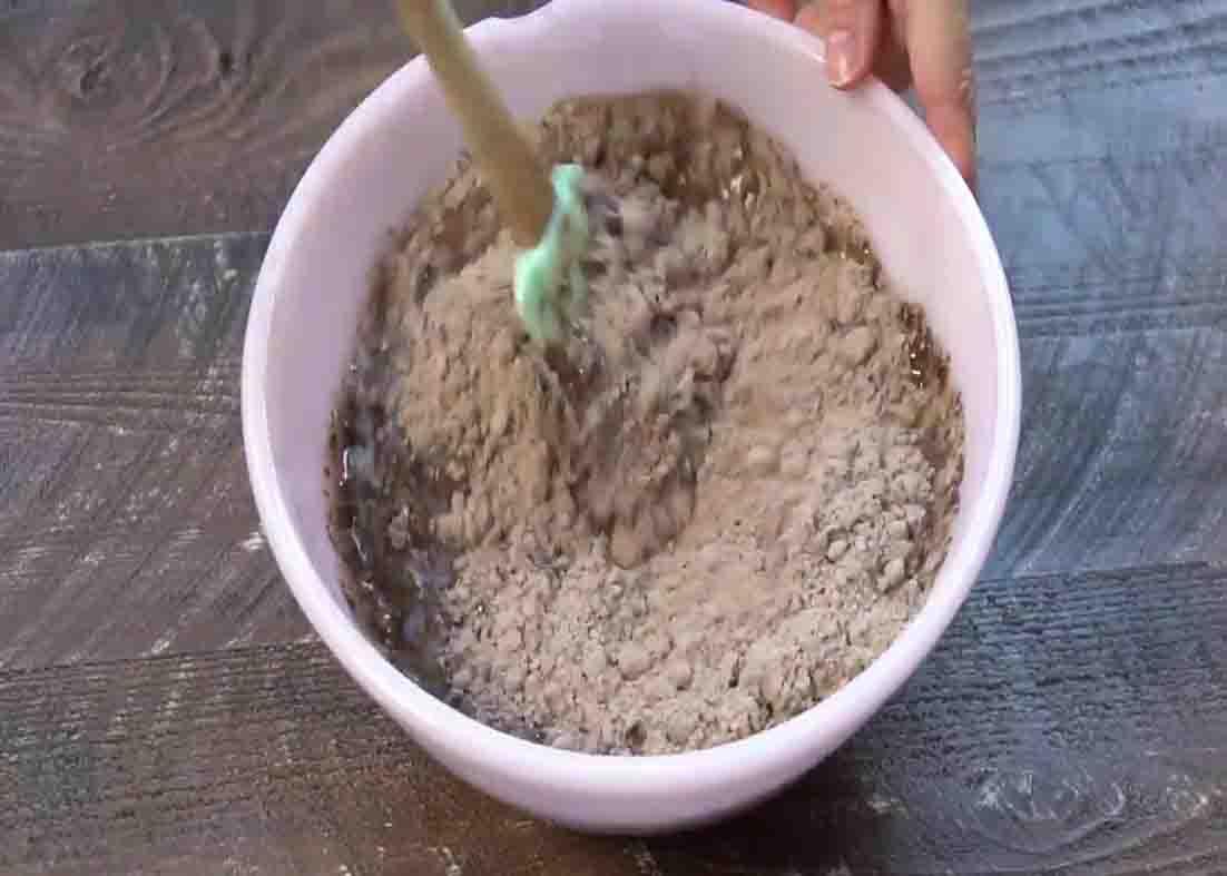Mixing the cake mix and melted butter for the cherry dump cake batter