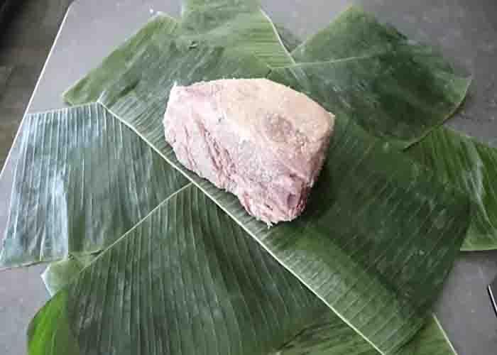 Wrapping your pork in banana leaves