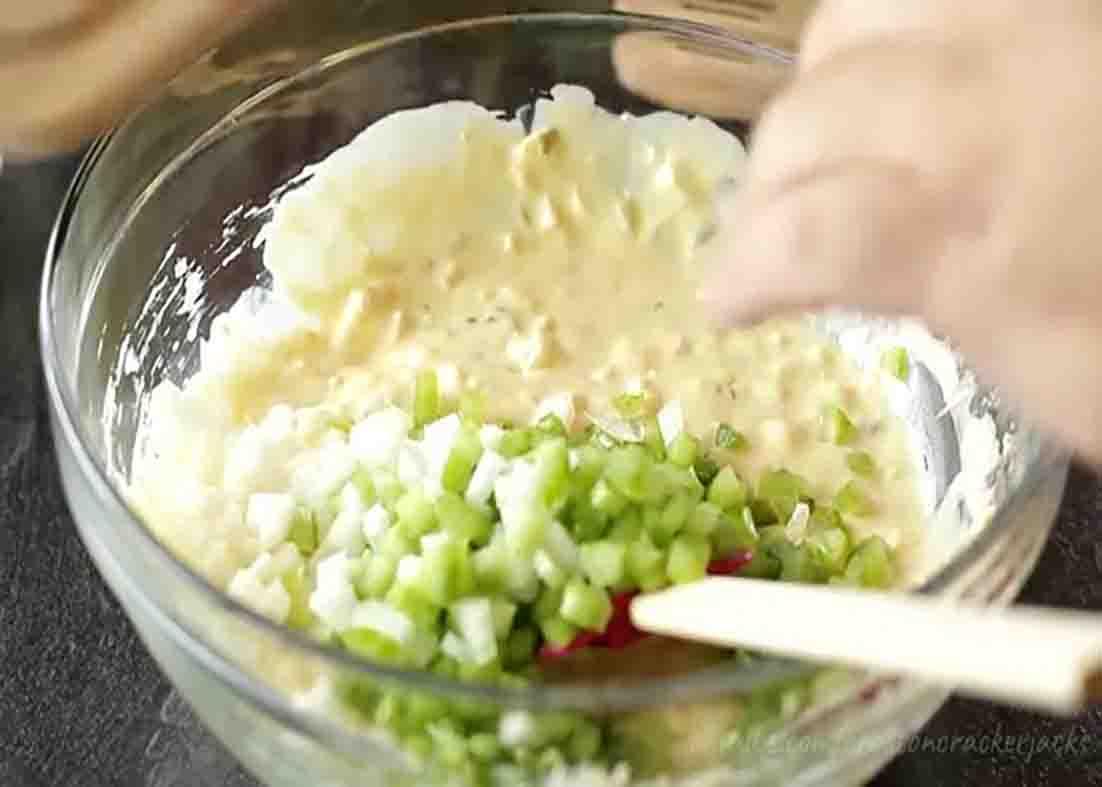 Mixing all the potato salad ingredients