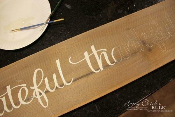 Grateful Thankful Blessed sign hand painted on a weathered wood board as rustic DIY Thanksgiving decor