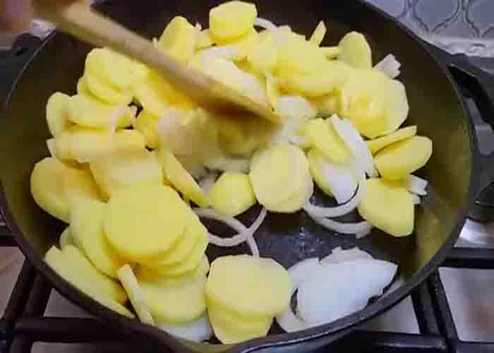 Sauteing the potatoes and onions