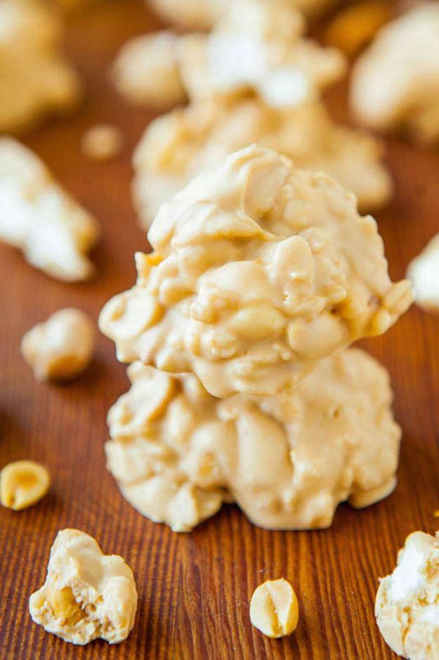 White chocolate peanut butter cookie clusters, pale crunchy clusters with peanuts and marshmallows on wood
