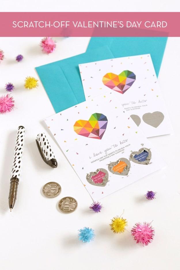 Scratch off Valentine's card with a metallic painted heart panel partly scratched away to reveal a message