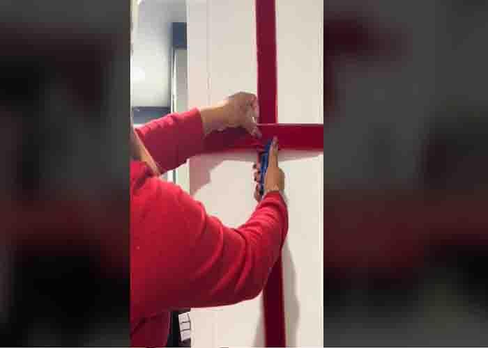 Stapling the ribbon to the cabinets