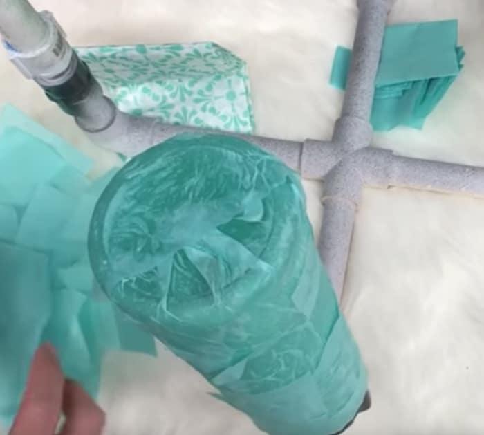 Make a glittered water bottle tumbler from Dollar Tree