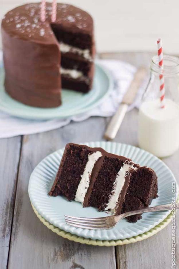 Chocolate layer cake with vanilla cream filling and salted caramel ganache, one slice served on a plate
