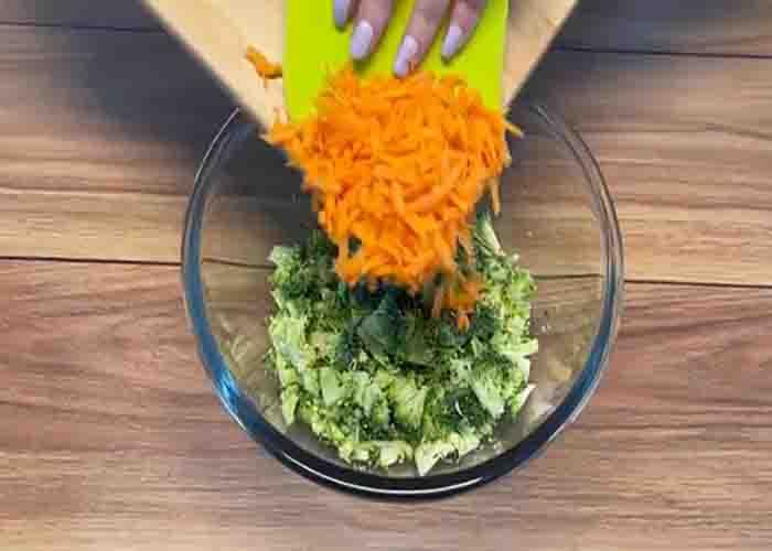 Adding the carrots to the broccoli salad