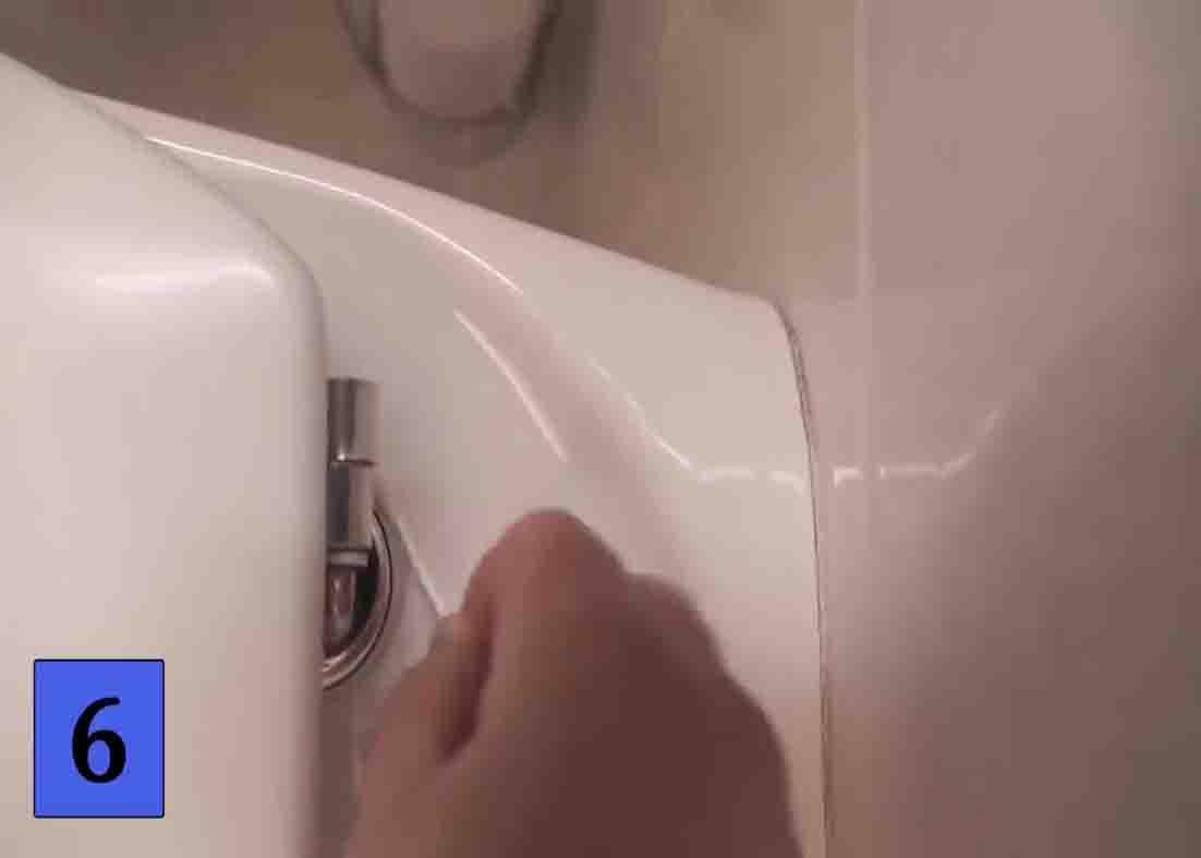 Using cotton buds to clean the bathroom