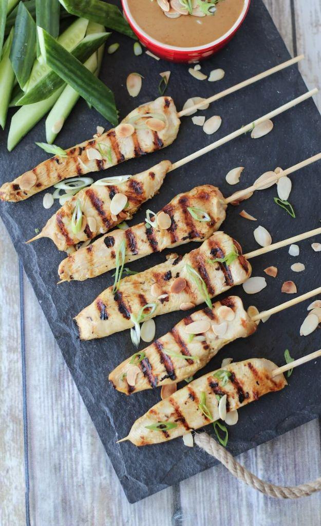 Gluten free chicken satay skewers grilled and served with a creamy Thai almond dipping sauce and lime