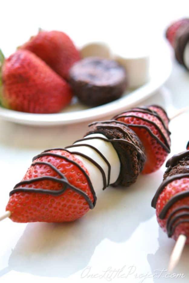 Strawberry brownie skewers threaded with marshmallows and drizzled with melted chocolate, an easy no fork party dessert