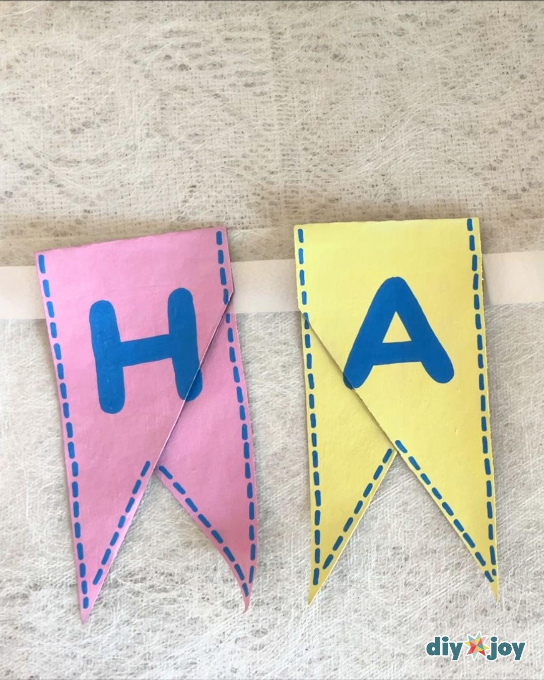 Birthday Banner Toilet Paper Rolls — hang