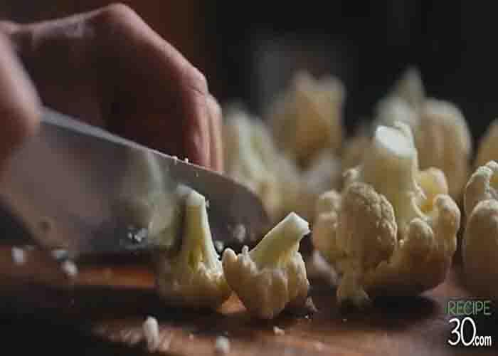 Chopping the cauliflower for the pasta dish