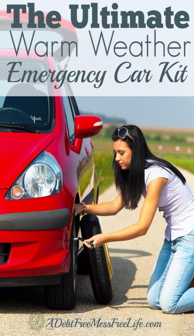 Ultimate warm weather emergency car kit, a woman kneeling to change a tire on a red car on a country road