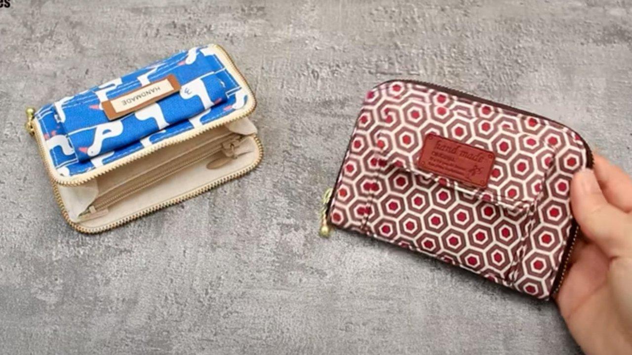 Zip around wallet, a blue and white patterned zip wallet open beside a closed red geometric print zip around wallet