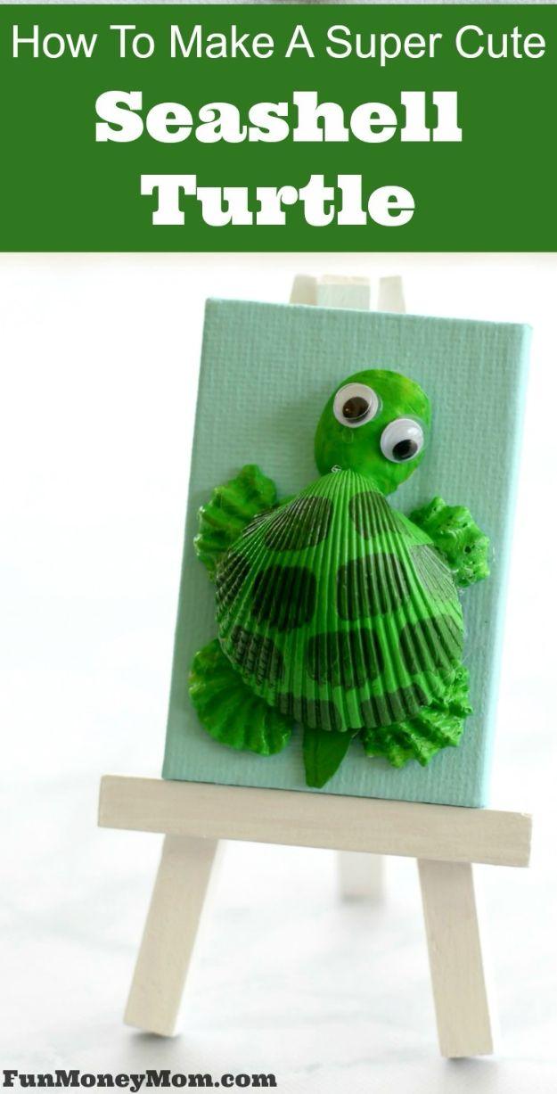 Green painted seashell turtle mounted on a small blue canvas sitting on a miniature wooden easel, under a typeset title