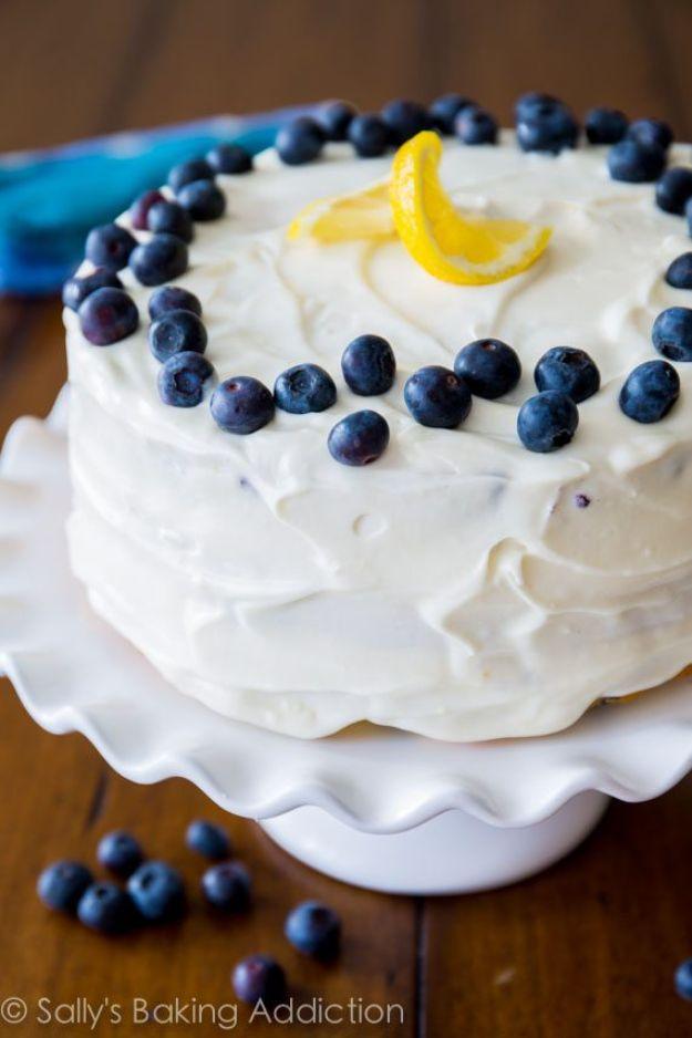 Lemon blueberry layer cake studded with berries under cream cheese frosting, a bright spring birthday cake