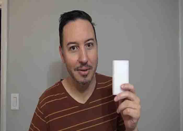 Using a magic eraser to clean stubborn stains in the baseboard