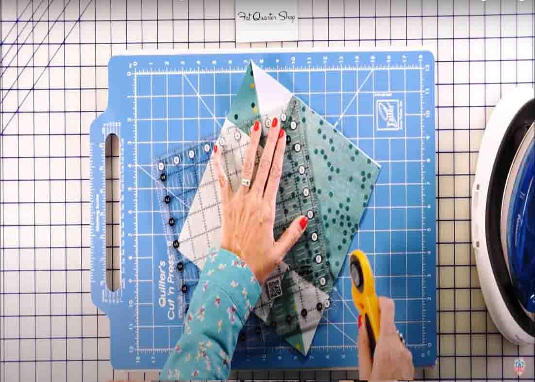 Trimming the unit for the hunter's star quilt block
