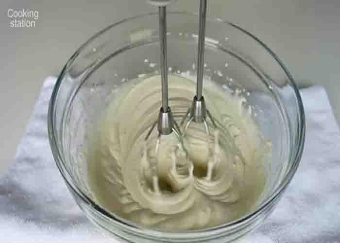 Making the whipped cream cheese for the lemon cake