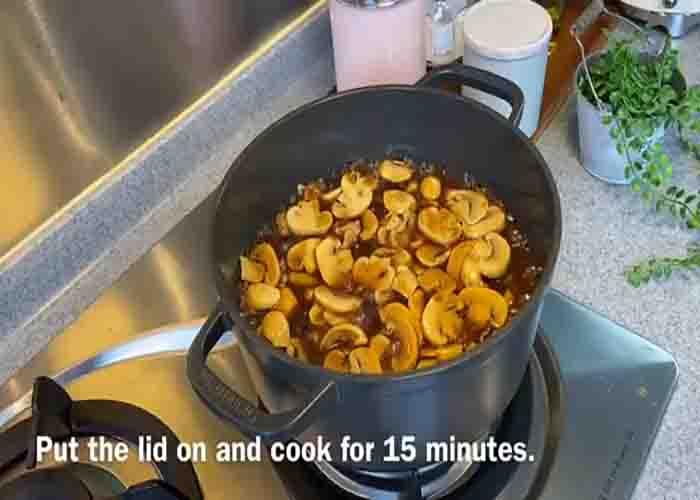 Cooking the mushrooms and rice in the pot