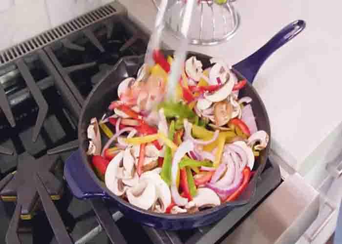 Sauteing the veggies for the steak fajitas recipe