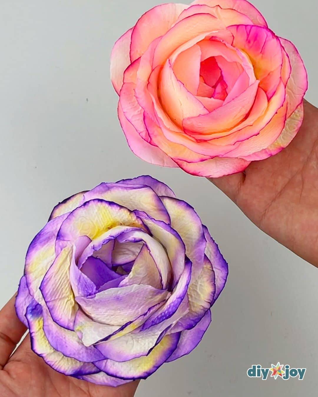 Homemade toilet paper roses in soft colors, an easy tissue paper flower craft shaped with a paper cup mold