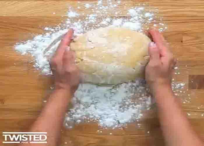 Kneading the dough to make the raspberry swirl buns