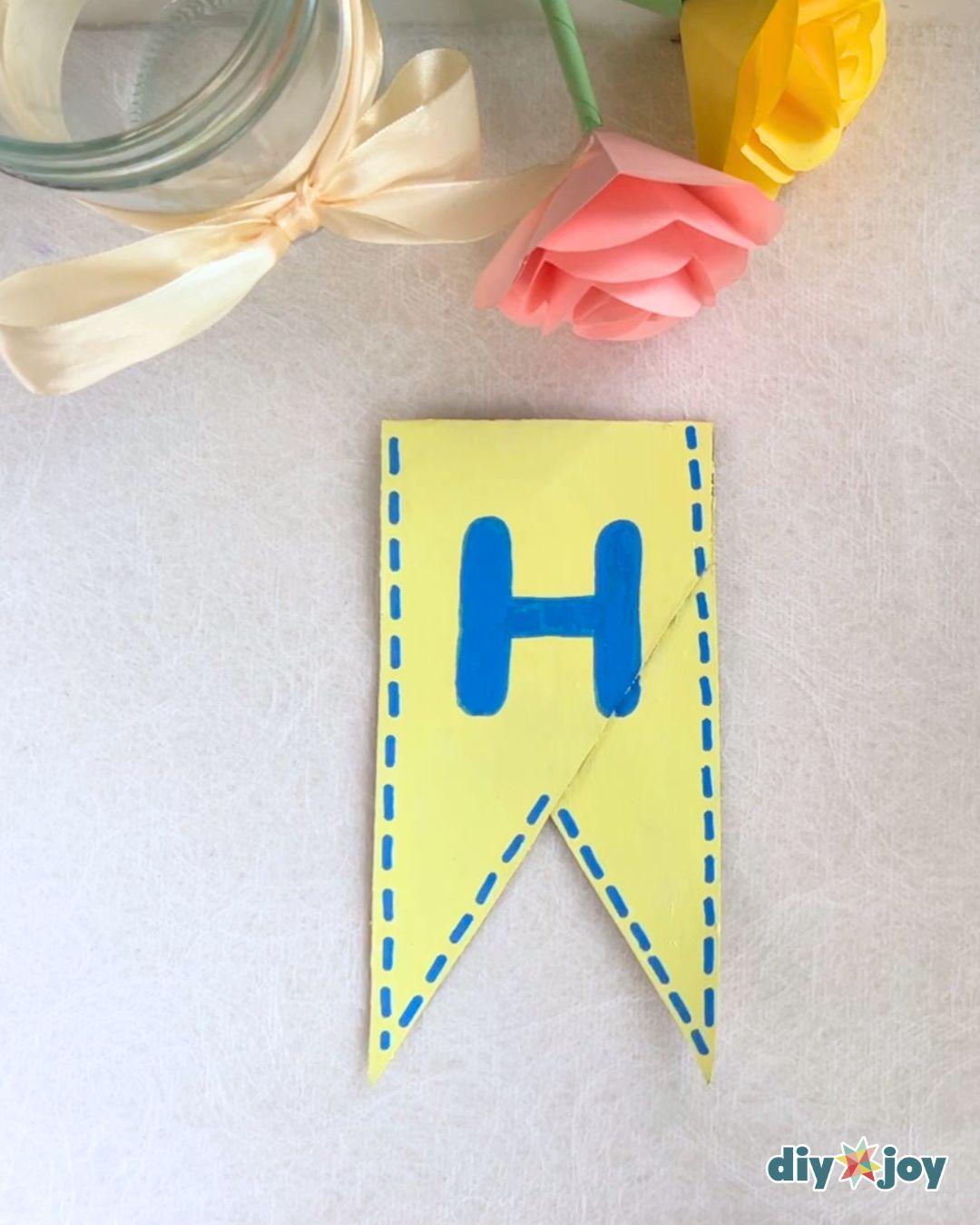Homemade Birthday Banner Toilet Paper Rolls — add border