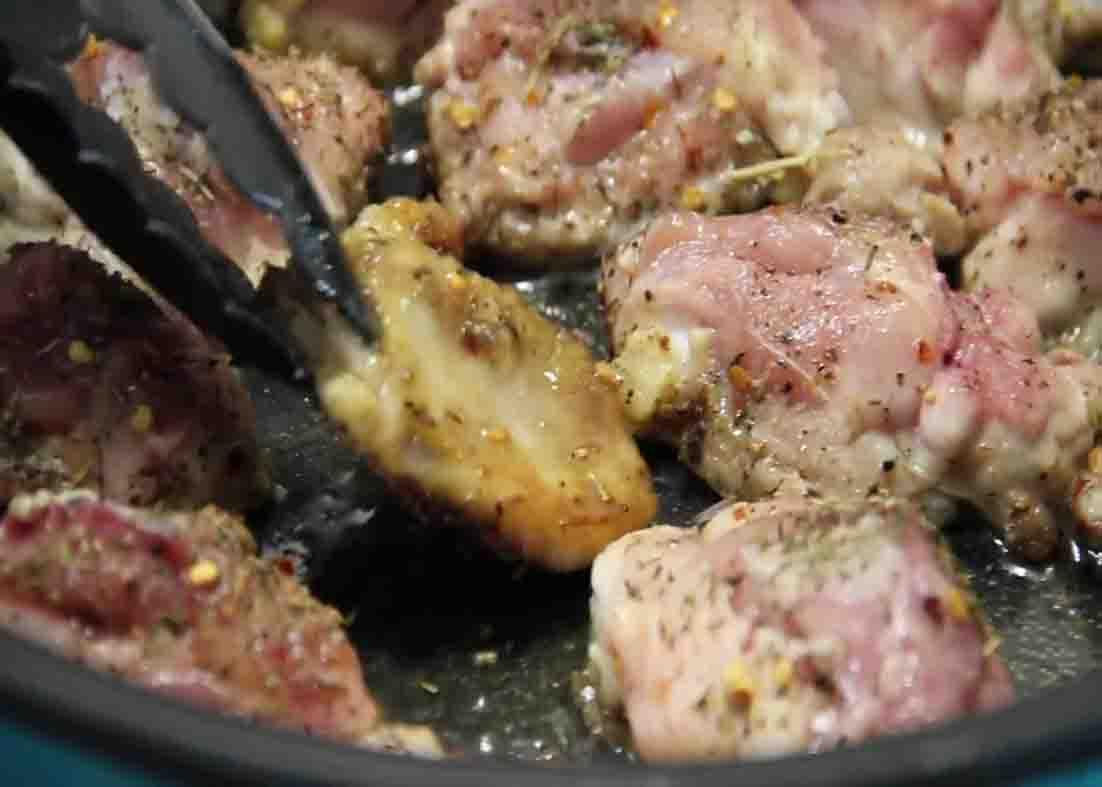 Frying the chicken thighs for the Italian chicken stew