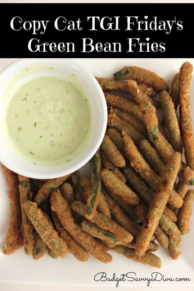 Copycat TGI Friday's green bean fries, battered fried green beans stacked beside a creamy dipping sauce